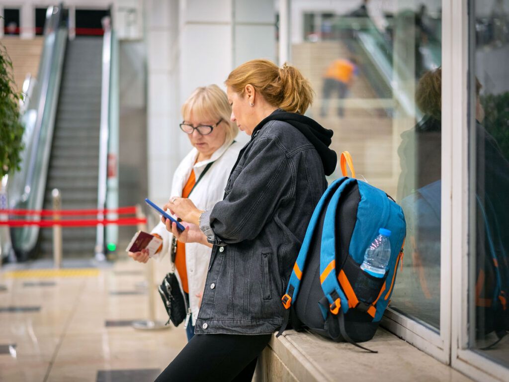 Two travelers in airport terminal