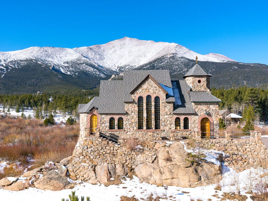 St. Catherine’s Chapel on the Rock surrounded by snow-capped mountains