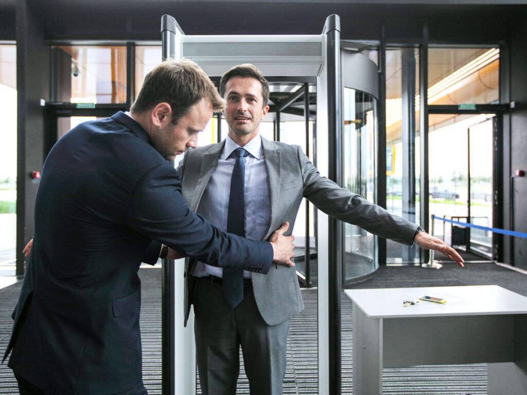 Passenger receiving pat-down at security checkpoint