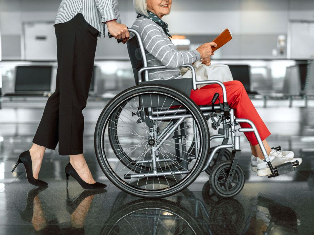 Traveler being pushed in wheelchair