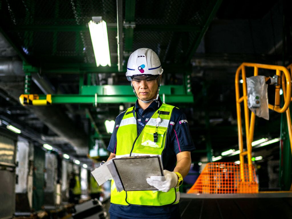 Airport employee reviewing clipboard