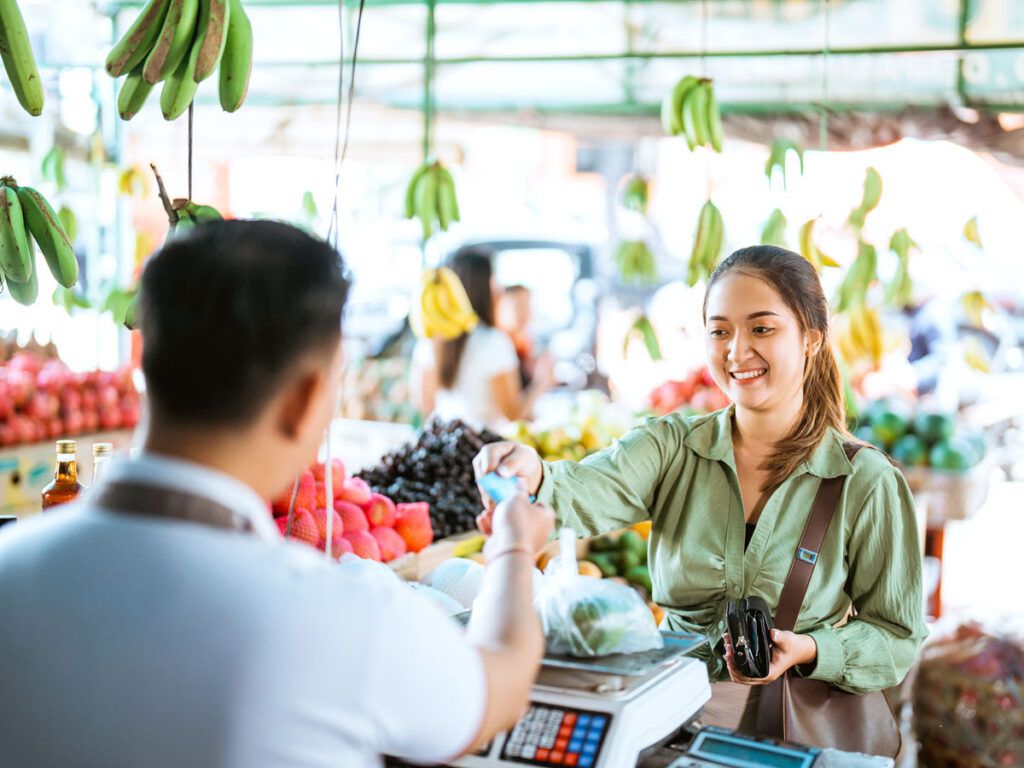 Customer handing credit card to merchant