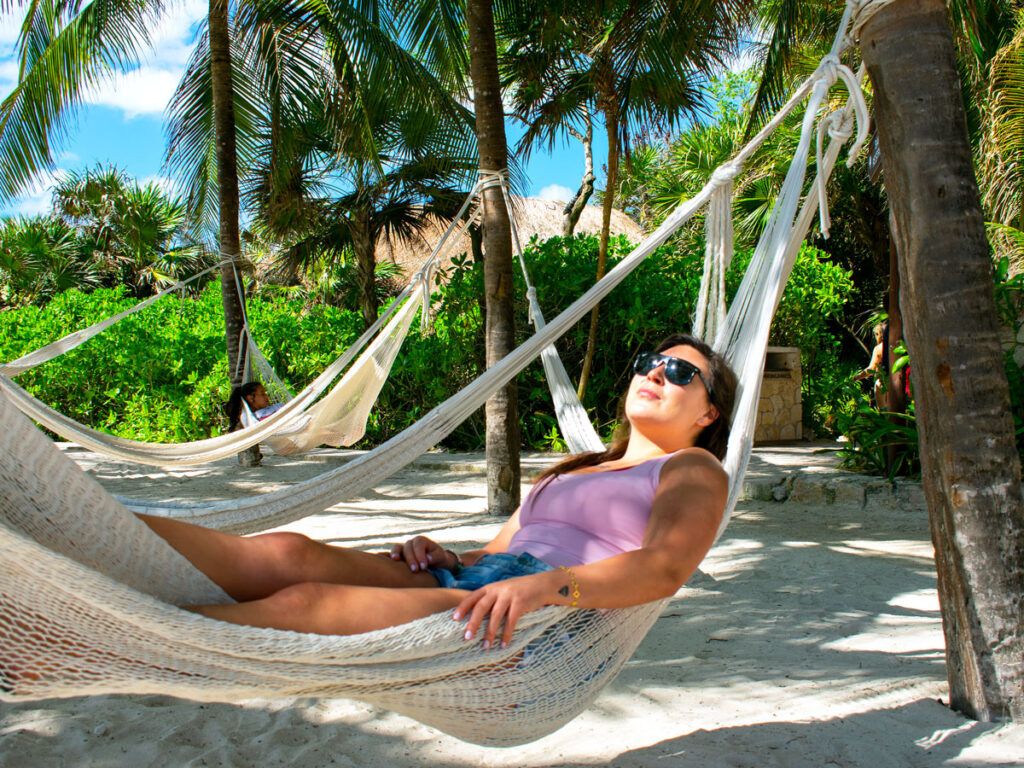 Traveler relaxing in beach hammock