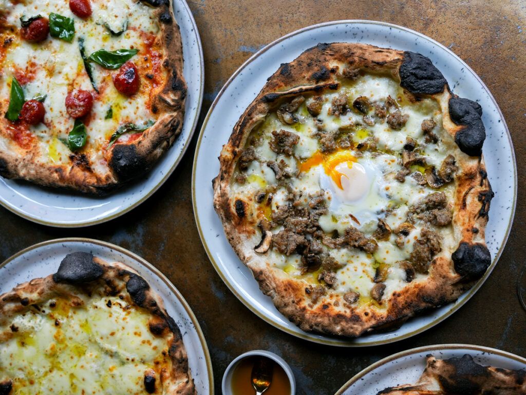 Tokyo-style pizzas on table
